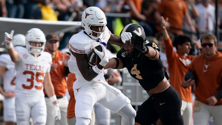 Texas Longhorns tight end Amari Niblack (8) is forced out of bounds by Vanderbilt Commodores linebacker Bryan Longwell (4) during the first half of their game at FirstBank Stadium in Nashville, Tenn., Saturday, Oct. 26, 2024.