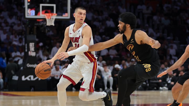 Apr 26, 2025; Miami, Florida, USA; Miami Heat guard Tyler Herro (14) dribbles the basketball as Cleveland Cavaliers center Jarrett Allen (31) defends in the third quarter during game three for the first round of the 2025 NBA Playoffs at Kaseya Center. Mandatory Credit: Sam Navarro-Imagn Images Apr 26, 2025; Miami, Florida, USA; Miami Heat guard Tyler Herro (14) dribbles the basketball as Cleveland Cavaliers center Jarrett Allen (31) defends in the third quarter during game three for the first round of the 2025 NBA Playoffs at Kaseya Center. Mandatory Credit: Sam Navarro-Imagn Images