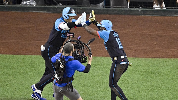 Jul 16, 2024; Arlington, Texas, USA; National League outfielder Jurickson Profar of the San Diego Padres (10) and National League designated hitter Shohei Ohtani of the Los Angeles Dodgers (17) celebrate after Ohtani hits a three run home rune against the American League during the third inning of the 2024 MLB All-Star game at Globe Life Field. Mandatory Credit: Jerome Miron-Imagn Images