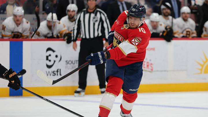 Apr 2, 2026; Sunrise, Florida, USA; Florida Panthers left wing A.J. Greer (10) shoots the puck against the Boston Bruins during the first period at Amerant Bank Arena. Mandatory Credit: Sam Navarro-Imagn Images