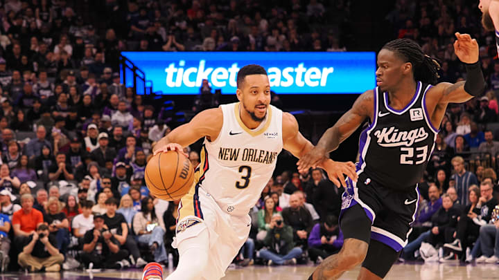 Feb 8, 2025; Sacramento, California, USA; New Orleans Pelicans guard CJ McCollum (3) drives in against Sacramento Kings guard Keon Ellis (23) during the fourth quarter at Golden 1 Center. Mandatory Credit: Kelley L Cox-Imagn Images