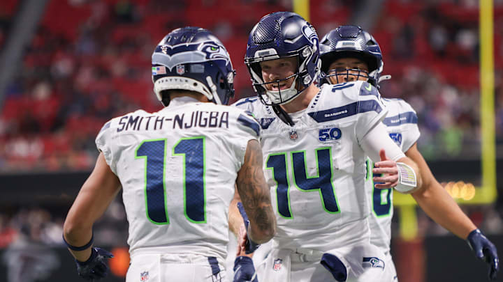 Dec 7, 2025; Atlanta, Georgia, USA; Seattle Seahawks wide receiver Jaxon Smith-Njigba (11) and quarterback Sam Darnold (14) celebrate after a touchdown against the Atlanta Falcons in the fourth quarter at Mercedes-Benz Stadium. Mandatory Credit: Brett Davis-Imagn Images Dec 7, 2025; Atlanta, Georgia, USA; Seattle Seahawks wide receiver Jaxon Smith-Njigba (11) and quarterback Sam Darnold (14) celebrate after a touchdown against the Atlanta Falcons in the fourth quarter at Mercedes-Benz Stadium. Mandatory Credit: Brett Davis-Imagn Images