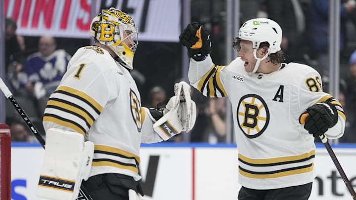 Apr 24, 2024; Toronto, Ontario, CAN;Boston Bruins forward David Pastrnak (88) and goaltender Jeremy Swayman (1) celebrate a win over the Toronto Maple Leafs in game three of the first round of the 2024 Stanley Cup Playoffs at Scotiabank Arena. Mandatory Credit: John E. Sokolowski-Imagn Images Apr 24, 2024; Toronto, Ontario, CAN;Boston Bruins forward David Pastrnak (88) and goaltender Jeremy Swayman (1) celebrate a win over the Toronto Maple Leafs in game three of the first round of the 2024 Stanley Cup Playoffs at Scotiabank Arena. Mandatory Credit: John E. Sokolowski-Imagn Images