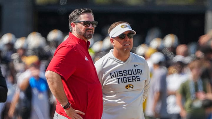 Columbia, Missouri, USA; Louisiana-Lafayette Ragin Cajuns head coach Michael Desormeaux talks with Missouri Tigers head coach Eli Drinkwitz on field prior to a game at Faurot Field at Memorial Stadium. Columbia, Missouri, USA; Louisiana-Lafayette Ragin Cajuns head coach Michael Desormeaux talks with Missouri Tigers head coach Eli Drinkwitz on field prior to a game at Faurot Field at Memorial Stadium.