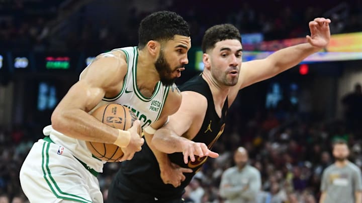 Mar 5, 2024; Cleveland, Ohio, USA; Boston Celtics forward Jayson Tatum (0) drives to the basket against Cleveland Cavaliers forward Georges Niang (20) during the first half at Rocket Mortgage FieldHouse. Mandatory Credit: Ken Blaze-Imagn Images Mar 5, 2024; Cleveland, Ohio, USA; Boston Celtics forward Jayson Tatum (0) drives to the basket against Cleveland Cavaliers forward Georges Niang (20) during the first half at Rocket Mortgage FieldHouse. Mandatory Credit: Ken Blaze-Imagn Images