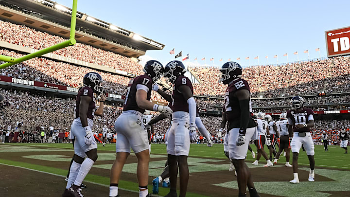 Sep 21, 2024; College Station, Texas, USA; Texas A&M Aggies tight end Donovan Green (18) celebrates after scoring a touchdown during the first quarter against the Bowling Green Falcons at Kyle Field. Mandatory Credit: Maria Lysaker-Imagn Images. 
