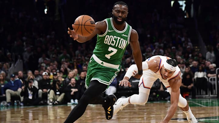 Feb 23, 2025; Boston, Massachusetts, USA; Boston Celtics guard Jaylen Brown (7) gains possession of the ball ahead of New York Knicks guard Josh Hart (3) during the second half at TD Garden. Mandatory Credit: Bob DeChiara-Imagn Images