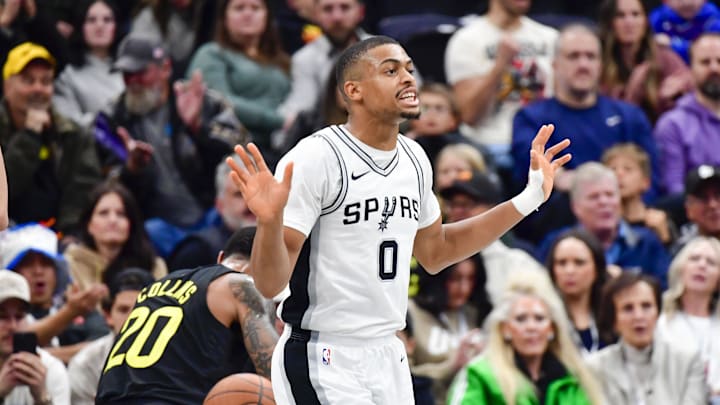 Nov 26, 2024; Salt Lake City, Utah, USA; San Antonio Spurs forward/guard Keldon Johnson (0) reacts to an offensive call against the Utah Jazz during the first half at the Delta Center. Mandatory Credit: Christopher Creveling-Imagn Images