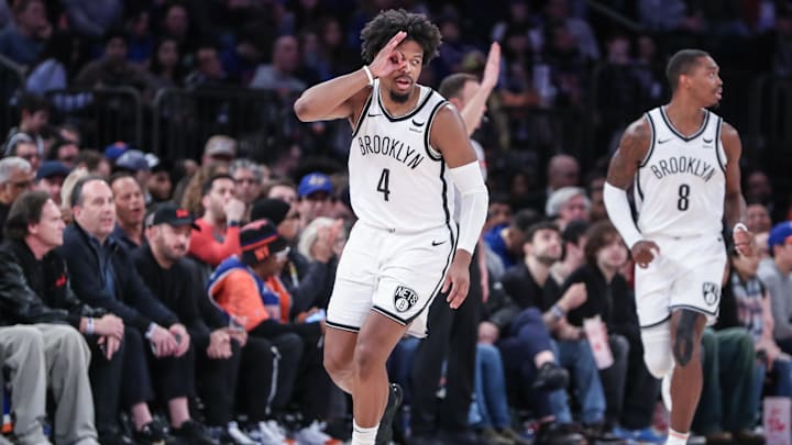 Mar 23, 2024; New York, New York, USA;  Brooklyn Nets guard Dennis Smith Jr. (4) gestures after making a three point shot in the fourth quarter against the New York Knicks at Madison Square Garden. Mandatory Credit: Wendell Cruz-Imagn Images