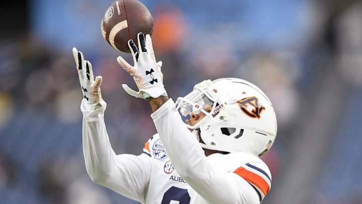 Dec 30, 2023; Nashville, TN, USA; Auburn Tigers wide receiver Koy Moore (0) makes a catch during