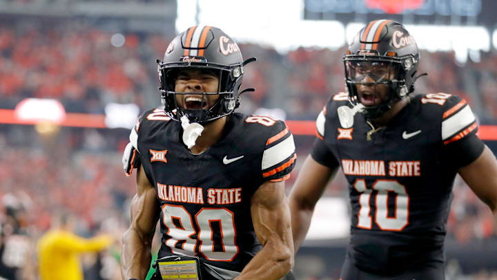 Big 12: Oklahoma State's Brennan Presley (80) celebrates his touchdown in the first half against the