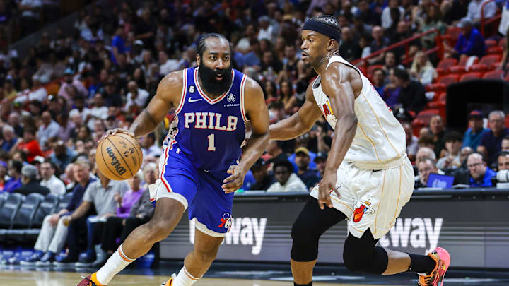Mar 1, 2023; Miami, Florida, USA; Philadelphia 76ers guard James Harden (1) dribbles the ball against Miami Heat forward Jimmy Butler (22) during the third quarter at Miami-Dade Arena. Mandatory Credit: Sam Navarro-Imagn Images