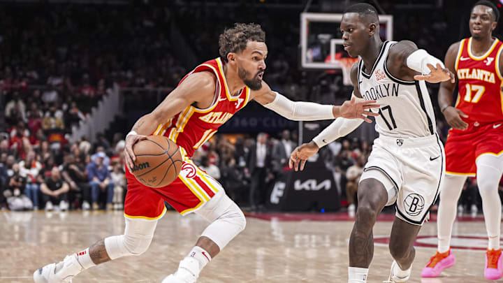 Oct 23, 2024; Atlanta, Georgia, USA; Atlanta Hawks guard Trae Young (11) dribbles against Brooklyn Nets guard Dennis Schroder (17) during the second half at State Farm Arena. Mandatory Credit: Dale Zanine-Imagn Images Oct 23, 2024; Atlanta, Georgia, USA; Atlanta Hawks guard Trae Young (11) dribbles against Brooklyn Nets guard Dennis Schroder (17) during the second half at State Farm Arena. Mandatory Credit: Dale Zanine-Imagn Images