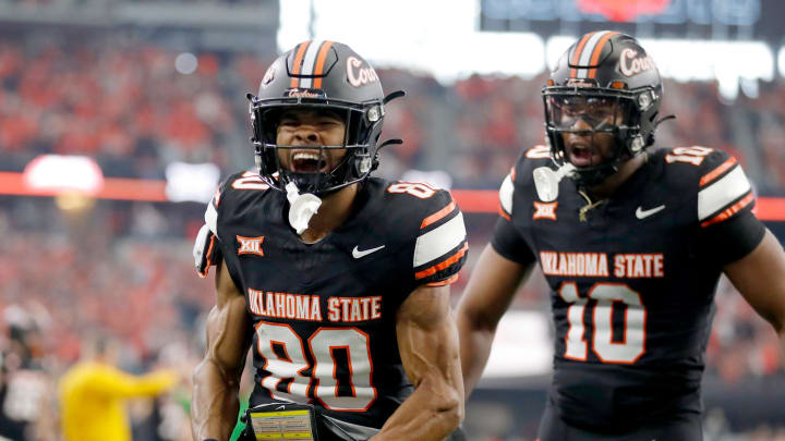 Big 12: Oklahoma State's Brennan Presley (80) celebrates his touchdown in the first half against the Texas Longhorns. Big 12: Oklahoma State's Brennan Presley (80) celebrates his touchdown in the first half against the Texas Longhorns.