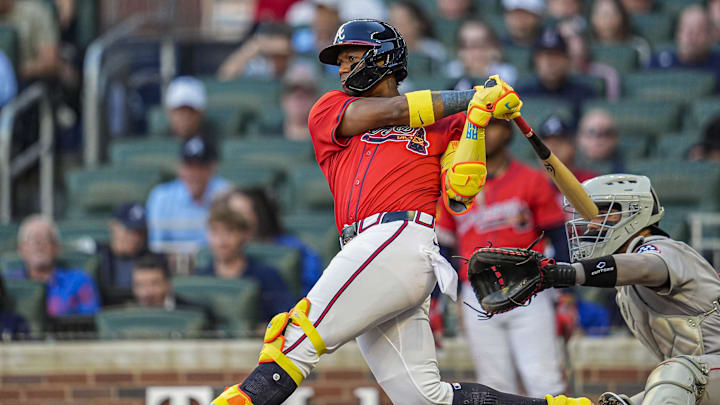 May 30, 2025; Cumberland, Georgia, USA; Atlanta Braves right fielder Ronald Acuna Jr (13) gets an infield single against the Boston Red Sox during the second inning at Truist Park. Mandatory Credit: Dale Zanine-Imagn Images