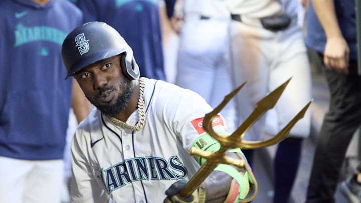 Seattle Mariners left fielder Randy Arozarena (56) celebrates a solo home run with the trident against the Kansas City Royals during the sixth inning at T-Mobile Park on July 2. 