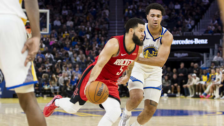 Dec 5, 2024; San Francisco, California, USA;  Houston Rockets guard Fred VanVleet (5) drives past Golden State Warriors center Trayce Jackson-Davis (32) during the third quarter at Chase Center. Mandatory Credit: John Hefti-Imagn Images