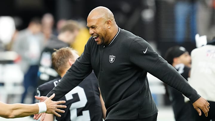 Nov 24, 2024; Paradise, Nevada, USA; Las Vegas Raiders head coach Antonio Pierce greets a player before the start of a game against the Denver Broncos at Allegiant Stadium. Mandatory Credit: Stephen R. Sylvanie-Imagn Images