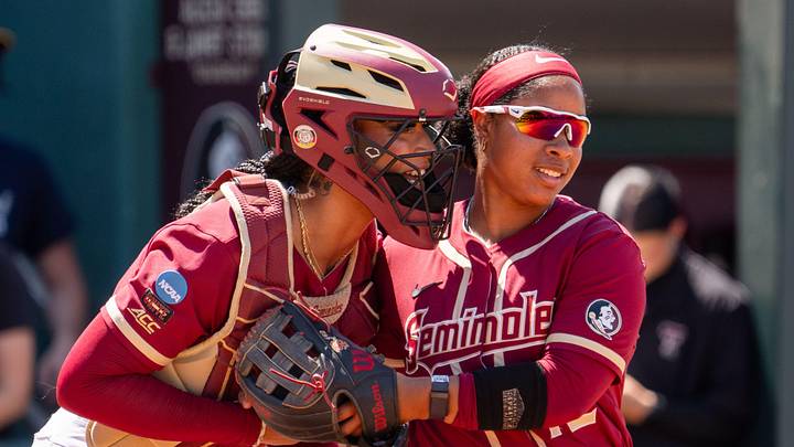 Florida State Seminoles catcher Michaela Edenfield (51) and infielder Jaysoni Beachum (42) talk before an inning during the 2025 season. Florida State Seminoles catcher Michaela Edenfield (51) and infielder Jaysoni Beachum (42) talk before an inning during the 2025 season.