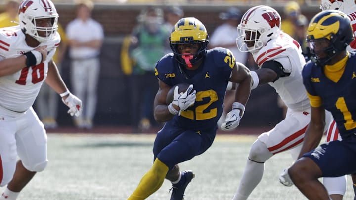 Oct 4, 2025; Ann Arbor, Michigan, USA;  Michigan Wolverines running back Justice Haynes (22) rushes in the second half against the Wisconsin Badgers at Michigan Stadium. Mandatory Credit: Rick Osentoski-Imagn Images