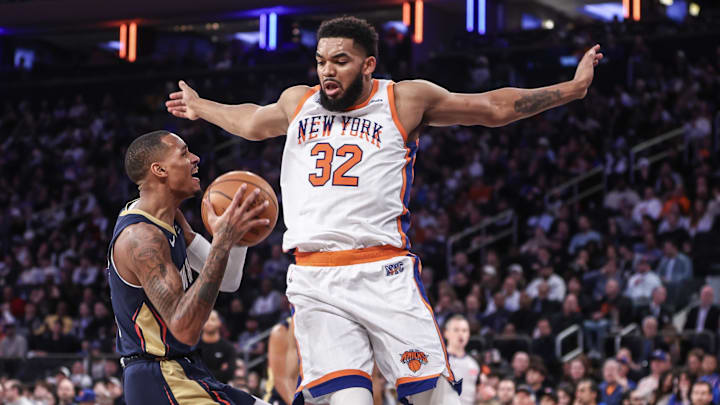 Dec 1, 2024; New York, New York, USA;  New Orleans Pelicans guard Dejounte Murray (5) looks to drive past New York Knicks center Karl-Anthony Towns (32) in the third quarter at Madison Square Garden. Mandatory Credit: Wendell Cruz-Imagn Images