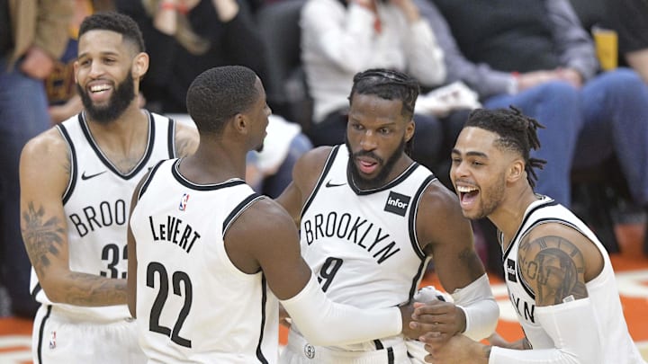 Feb 13, 2019; Cleveland, OH, USA; Brooklyn Nets forward DeMarre Carroll (9) celebrates with his teammates after making a 3-point basket to force a third overtime against the Cleveland Cavaliers at Quicken Loans Arena. Mandatory Credit: David Richard-Imagn Images