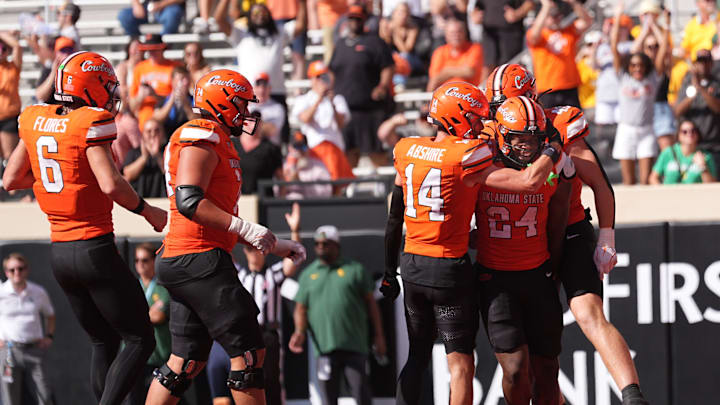 Oklahoma State celebrates a Trent Howland (24) touchdown in the first half of the college football game between the Oklahoma State Cowboys and the Baylor Bears at Boone Pickens Stadium in Stillwater, Okla., Saturday, Sept. 27, 2025. Oklahoma State celebrates a Trent Howland (24) touchdown in the first half of the college football game between the Oklahoma State Cowboys and the Baylor Bears at Boone Pickens Stadium in Stillwater, Okla., Saturday, Sept. 27, 2025.