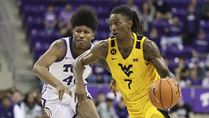 Feb 5, 2025; Fort Worth, Texas, USA; West Virginia Mountaineers guard Javon Small (7) shoots the ball past TCU Horned Frogs guard Jace Posey (41) during the second half at Ed and Rae Schollmaier Arena. Mandatory Credit: Kevin Jairaj-Imagn Images Feb 5, 2025; Fort Worth, Texas, USA; West Virginia Mountaineers guard Javon Small (7) shoots the ball past TCU Horned Frogs guard Jace Posey (41) during the second half at Ed and Rae Schollmaier Arena. Mandatory Credit: Kevin Jairaj-Imagn Images
