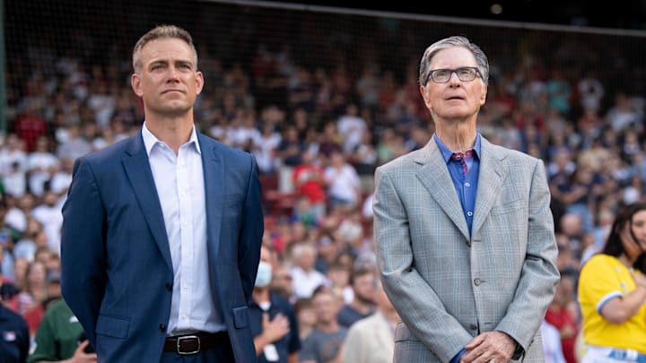 John Henry (right) stands next to Theo Epstein (left) before a game between the Boston Red Sox and the Cleveland Guardians.