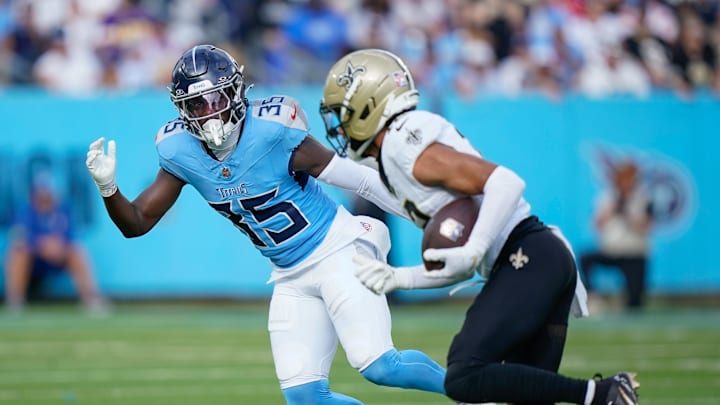 Dec 28, 2025; Nashville, Tennessee, USA; Tennessee Titans cornerback Kaiir Elam (35) chases down New Orleans Saints wide receiver Chris Olave (12) after a catch and run during the second quarter at Nissan Stadium. Mandatory Credit: Denny Simmons-USA TODAY Network via Imagn Images
