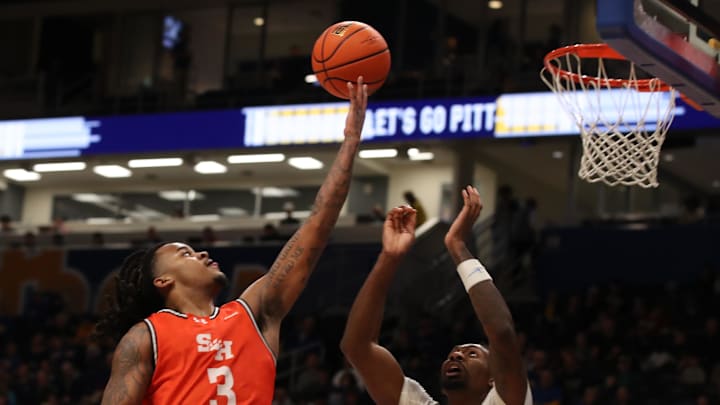 Dec 21, 2024; Pittsburgh, Pennsylvania, USA;  Sam Houston State Bearkats guard Lamar Wilkerson (3) shoots against Pittsburgh Panthers forward Zack Austin (55) during the second half at the Petersen Events Center. Mandatory Credit: Charles LeClaire-Imagn Images