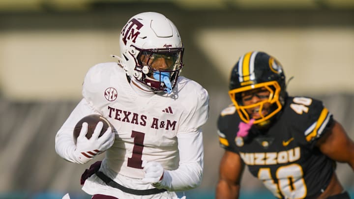 Nov 8, 2025; Columbia, Missouri, USA; Texas A&M Aggies wide receiver Mario Craver (1) runs with the ball during the first half against the Missouri Tigers at Faurot Field at Memorial Stadium. Mandatory Credit: Jay Biggerstaff-Imagn Images