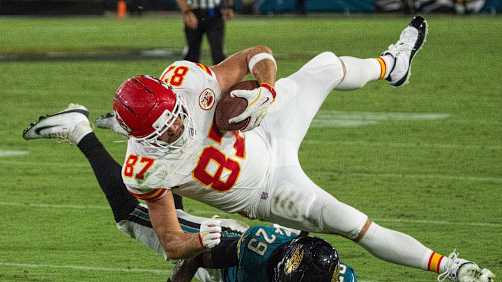 Jacksonville Jaguars safety Eric Murray (29) upends Kansas City Chiefs tight end Travis Kelce (87) in the fourth quarter during a Monday Night NFL football game at EverBank Stadium, Monday, Oct. 6, 2025, in Jacksonville, Fla. [Doug EngleFlorida Times-Union]