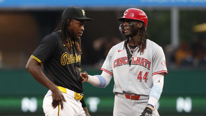 Jun 17, 2024; Pittsburgh, Pennsylvania, USA;  Pittsburgh Pirates shortstop Oneil Cruz (15) and Cincinnati Reds shortstop Elly De La Cruz (44) talk at second base after a double by De La Cruz during the third inning at PNC Park. Mandatory Credit: Charles LeClaire-USA TODAY Sports