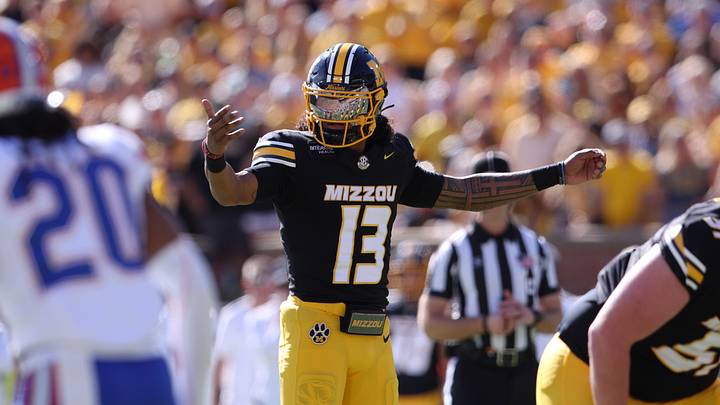 Oct 3, 2026; Columbia, Missouri, USA;  Missouri Tigers quarterback Austin Simmons (13) calls a play in the first quarter against the Florida Gators at Faurot Field at Memorial Stadium.  Mandatory Credit: William Purnell-Imagn Images