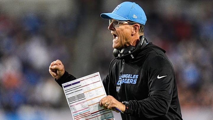 LA Chargers head coach Jim Harbaugh celebrates a touchdown against Detroit Lions during the first half of the Hall of Fame Game at Tom Benson Hall of Fame Stadium in Canton, Ohio on Thursday, July 31, 2025.