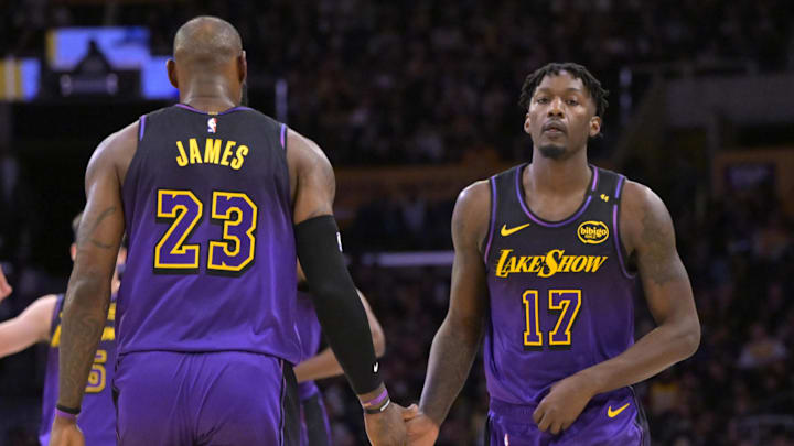 Jan 2, 2025; Los Angeles, California, USA;  Los Angeles Lakers forward Dorian Finney-Smith (17) subs into the game for forward LeBron James (23) in the first half against the Portland Trail Blazers at Crypto.com Arena. Mandatory Credit: Jayne Kamin-Oncea-Imagn Images