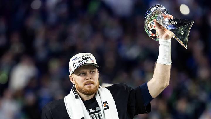 Feb 8, 2026; Santa Clara, CA, USA; Seattle Seahawks quarterback Sam Darnold (14) celebrates with the Vince Lombardi Trophy after defeating the New England Patriots during Super Bowl LX at Levi's Stadium. Mandatory Credit: Mark J. Rebilas-Imagn Images