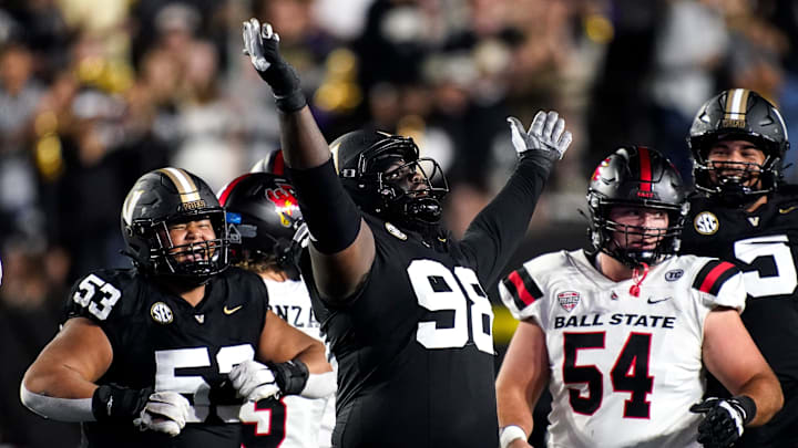 Vanderbilt defensive lineman De'Marion Thomas (98) celebrates sacking Ball State quarterback Kadin Semonza (3) during the second quarter at FirstBank Stadium in Nashville, Tenn., Saturday, Oct. 19, 2024. Vanderbilt defensive lineman De'Marion Thomas (98) celebrates sacking Ball State quarterback Kadin Semonza (3) during the second quarter at FirstBank Stadium in Nashville, Tenn., Saturday, Oct. 19, 2024.