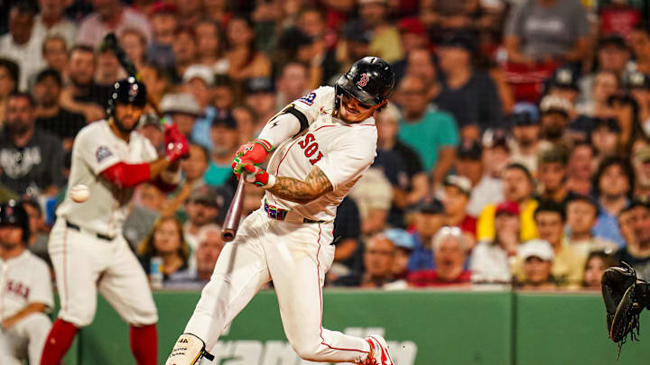 Boston Red Sox outfielder Jarren Duran (16) hits a single to drive in a run against the Colorado Rockies in the sixth inning at Fenway Park on July 8. 