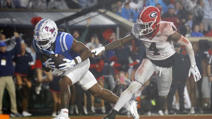 Nov 9, 2024; Oxford, Mississippi, USA; Mississippi Rebels wide receiver Antwane Wells Jr. (3) catches the ball for a touchdown over Georgia Bulldogs defensive back KJ Bolden (4) during the second half at Vaught-Hemingway Stadium. Mandatory Credit: Petre Thomas-Imagn Images Nov 9, 2024; Oxford, Mississippi, USA; Mississippi Rebels wide receiver Antwane Wells Jr. (3) catches the ball for a touchdown over Georgia Bulldogs defensive back KJ Bolden (4) during the second half at Vaught-Hemingway Stadium. Mandatory Credit: Petre Thomas-Imagn Images
