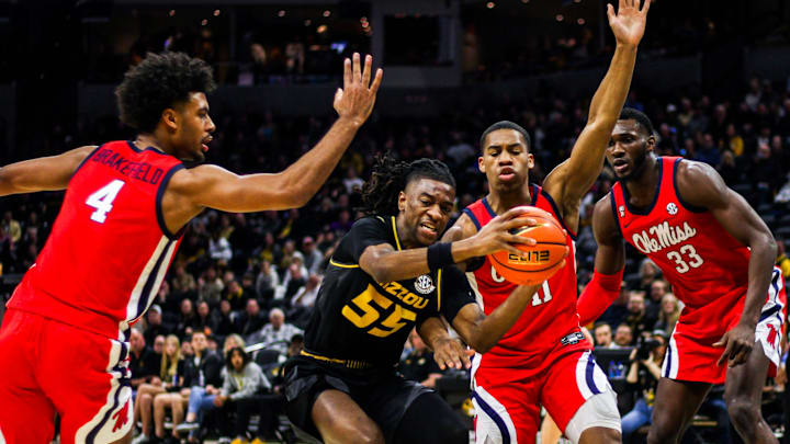 Missouri guard Sean East II fights past defenders during a college basketball game against Ole Miss
