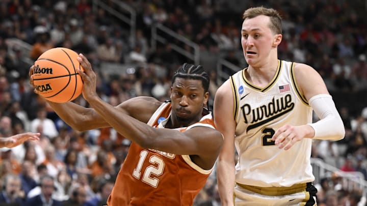 Mar 26, 2026; San Jose, CA, USA; Texas Longhorns guard Tramon Mark (12) goes to the basket against Purdue Boilermakers guard Fletcher Loyer (2) in the first half during a Sweet Sixteen game of the West Regional of the men's 2026 NCAA Tournament at SAP Center. Mandatory Credit: Eakin Howard-Imagn Images