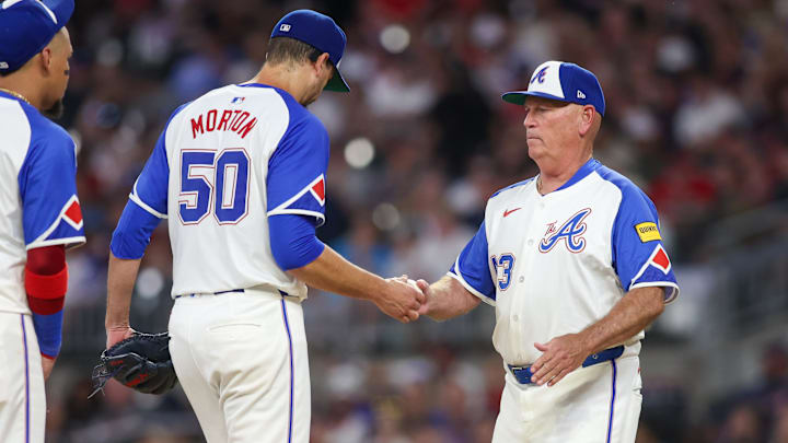 Aug 24, 2024; Atlanta, Georgia, USA; Atlanta Braves manager Brian Snitker (43) removes starting pitcher Charlie Morton (50) from a game against the Washington Nationals in the sixth inning at Truist Park. Mandatory Credit: Brett Davis-Imagn Images
