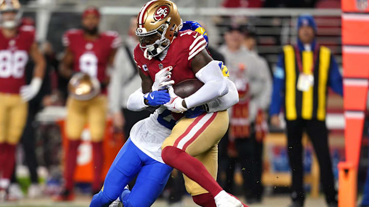 Dec 12, 2024; Santa Clara, California, USA; San Francisco 49ers wide receiver Deebo Samuel Sr. (1) runs with the ball after making a catch next to Los Angeles Rams cornerback Darious Williams (24) in the first quarter at Levi's Stadium. Mandatory Credit: Cary Edmondson-Imagn Images Dec 12, 2024; Santa Clara, California, USA; San Francisco 49ers wide receiver Deebo Samuel Sr. (1) runs with the ball after making a catch next to Los Angeles Rams cornerback Darious Williams (24) in the first quarter at Levi's Stadium. Mandatory Credit: Cary Edmondson-Imagn Images