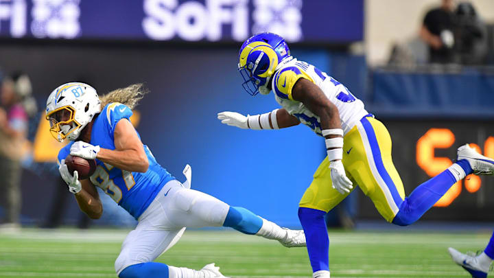 Aug 17, 2024; Inglewood, California, USA; Los Angeles Chargers wide receiver Simi Fehoko (87) catches a pass ahead of Los Angeles Rams safety Jaylen McCollough (39) during the first half at SoFi Stadium. Mandatory Credit: Gary A. Vasquez-Imagn Images