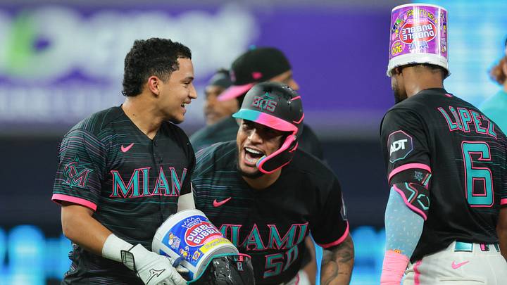 Miami Marlins third baseman Javier Sanoja (8) celebrates with catcher Agustín Ramírez (50) and shortstop Otto Lopez (6) after hitting a walk-off single. Credit: Sam Navarro-Imagn Images Miami Marlins third baseman Javier Sanoja (8) celebrates with catcher Agustín Ramírez (50) and shortstop Otto Lopez (6) after hitting a walk-off single. Credit: Sam Navarro-Imagn Images