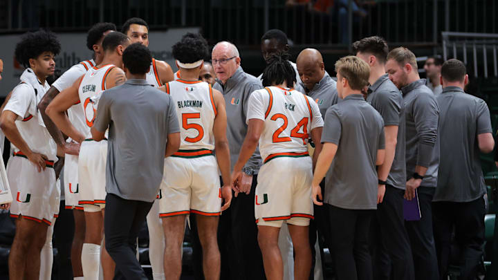Dec 7, 2024; Coral Gables, Florida, USA; Miami Hurricanes head coach Jim Larranaga talks to his players during a timeline against the Clemson Tigers in the first half at Watsco Center. Mandatory Credit: Sam Navarro-Imagn Images