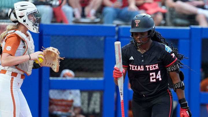 Texas Tech pitcher NiJaree Canady (24) reacts beside Texas utility Reese Atwood (14) after striking out in the fourth inning during Game 1 of the Women's College World Series championship series between the Texas Longhorns at Texas Tech Red Raiders at Devon Park in Oklahoma City, Wednesday, June 4, 2025. Texas won 2-1. Texas Tech pitcher NiJaree Canady (24) reacts beside Texas utility Reese Atwood (14) after striking out in the fourth inning during Game 1 of the Women's College World Series championship series between the Texas Longhorns at Texas Tech Red Raiders at Devon Park in Oklahoma City, Wednesday, June 4, 2025. Texas won 2-1.