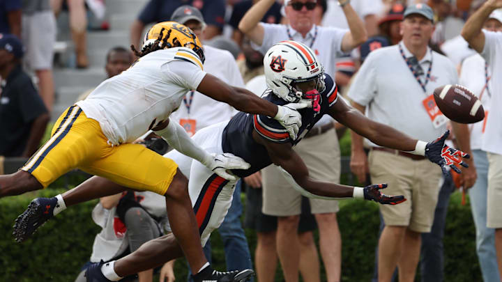 Sep 7, 2024; Auburn, Alabama, USA;  Auburn Tigers wide receiver Cam Coleman (8) dives for a pass as California Golden Bears defensive back Nohl Williams (3) defends during the fourth quarter at Jordan-Hare Stadium. Mandatory Credit: John Reed-Imagn Images